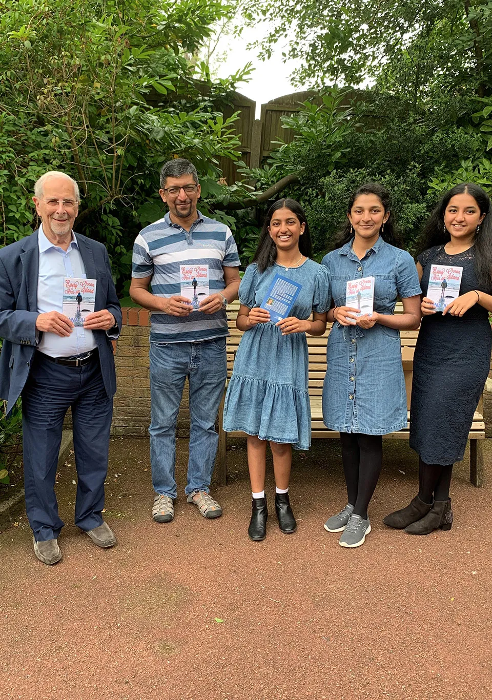 Liana Juby and family with book